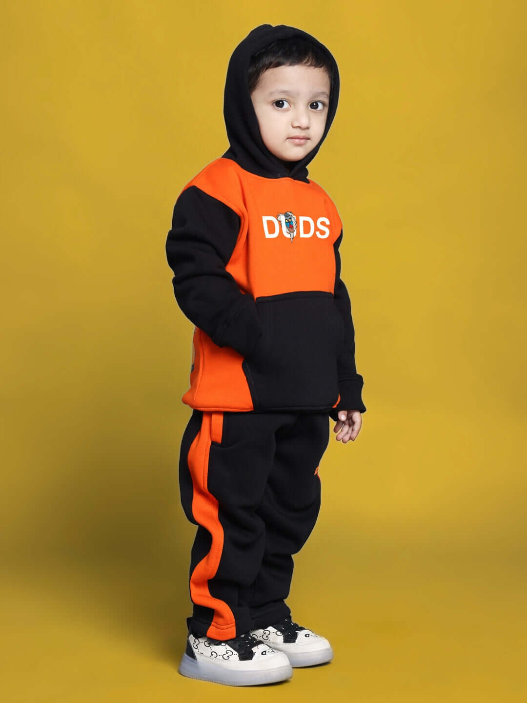 RAFIKI CO-ORD FOR BOYS GIRLS BLACK ORANGE with kid in trendy outfit