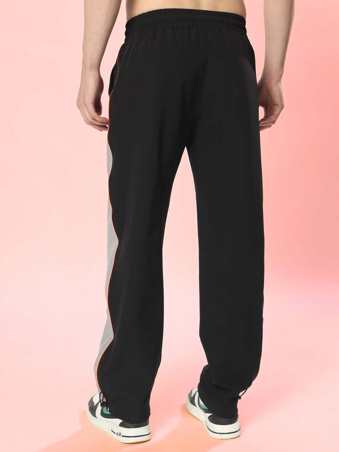 Back view of Rage Relaxed Fit Cargo Pants in black-grey, showcasing casual style and customizable fit for personalized comfort.