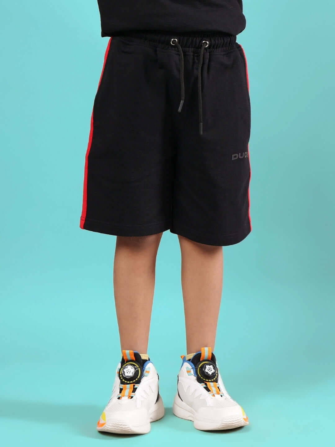 RAINBOW SUMMER CO-ORD FOR BOYS & GIRLS BLACK shorts, front view, model wearing white sneakers.