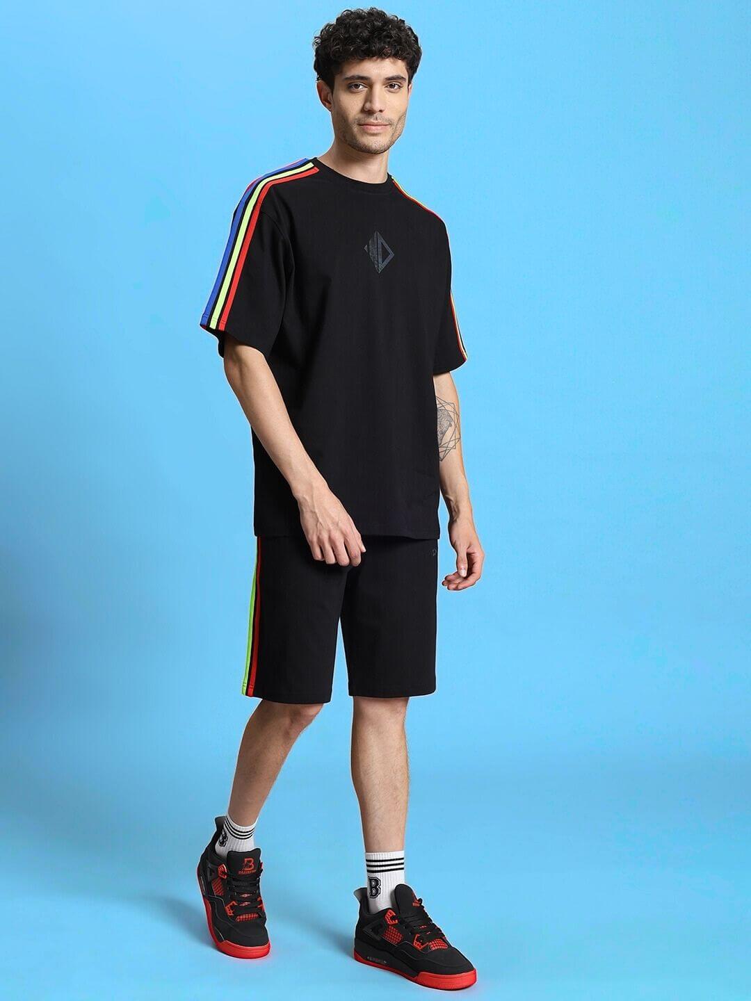 Model wearing RAINBOW SUMMER CO-ORD SET BLACK with vibrant rainbow accents, perfect for streetwear style in breathable fabric.