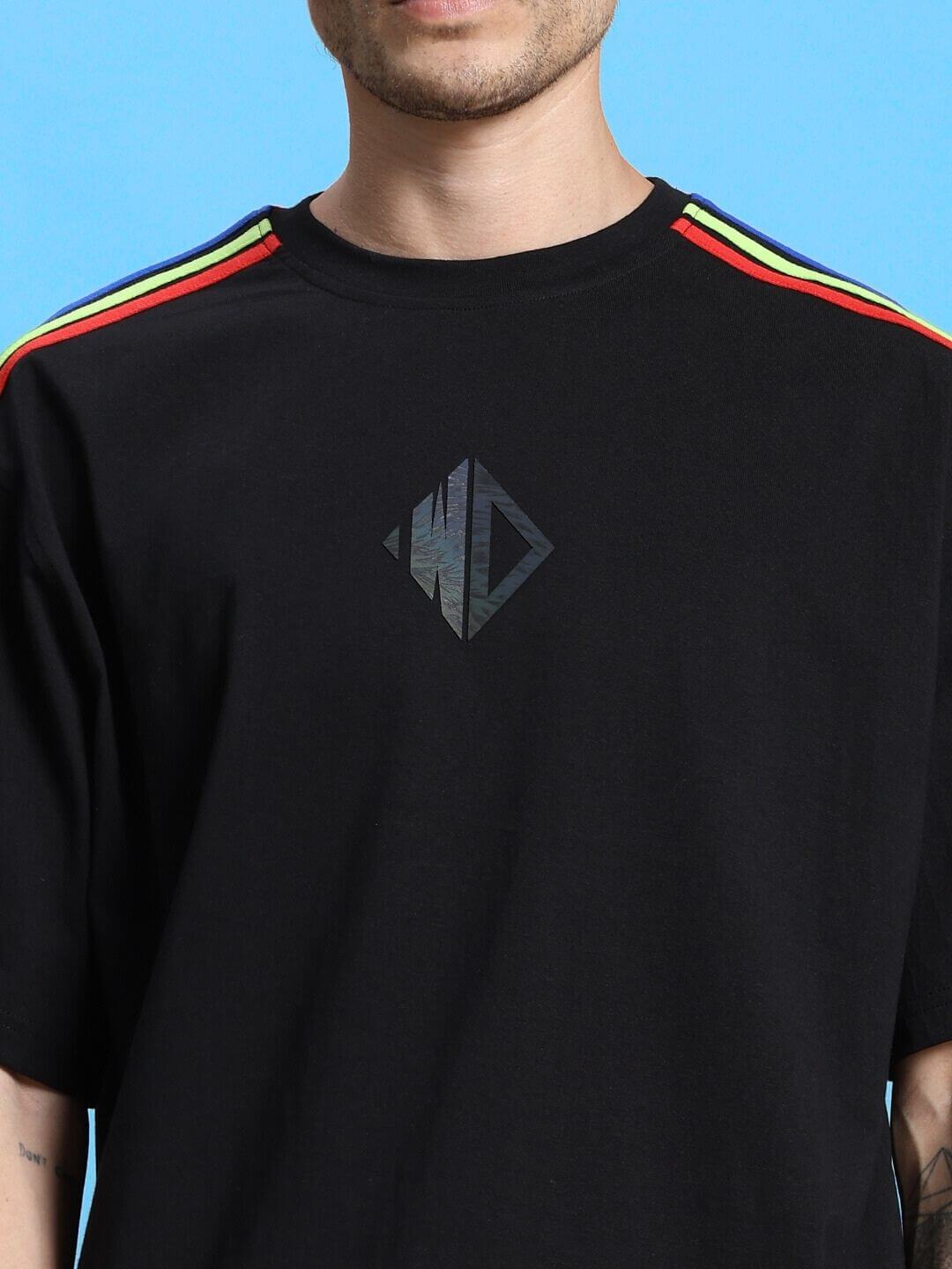 Black oversized T-shirt with rainbow shoulder stripes, featuring a premium cotton blend fabric. Ideal for fashion-forward comfort and style.
