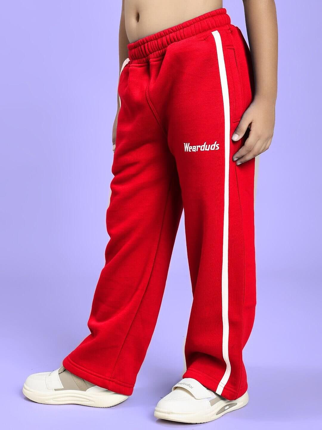 Child wearing RAPID STRIDE FLEECE CO-ORD FOR BOYS AND GIRLS RED showing red fleece joggers.