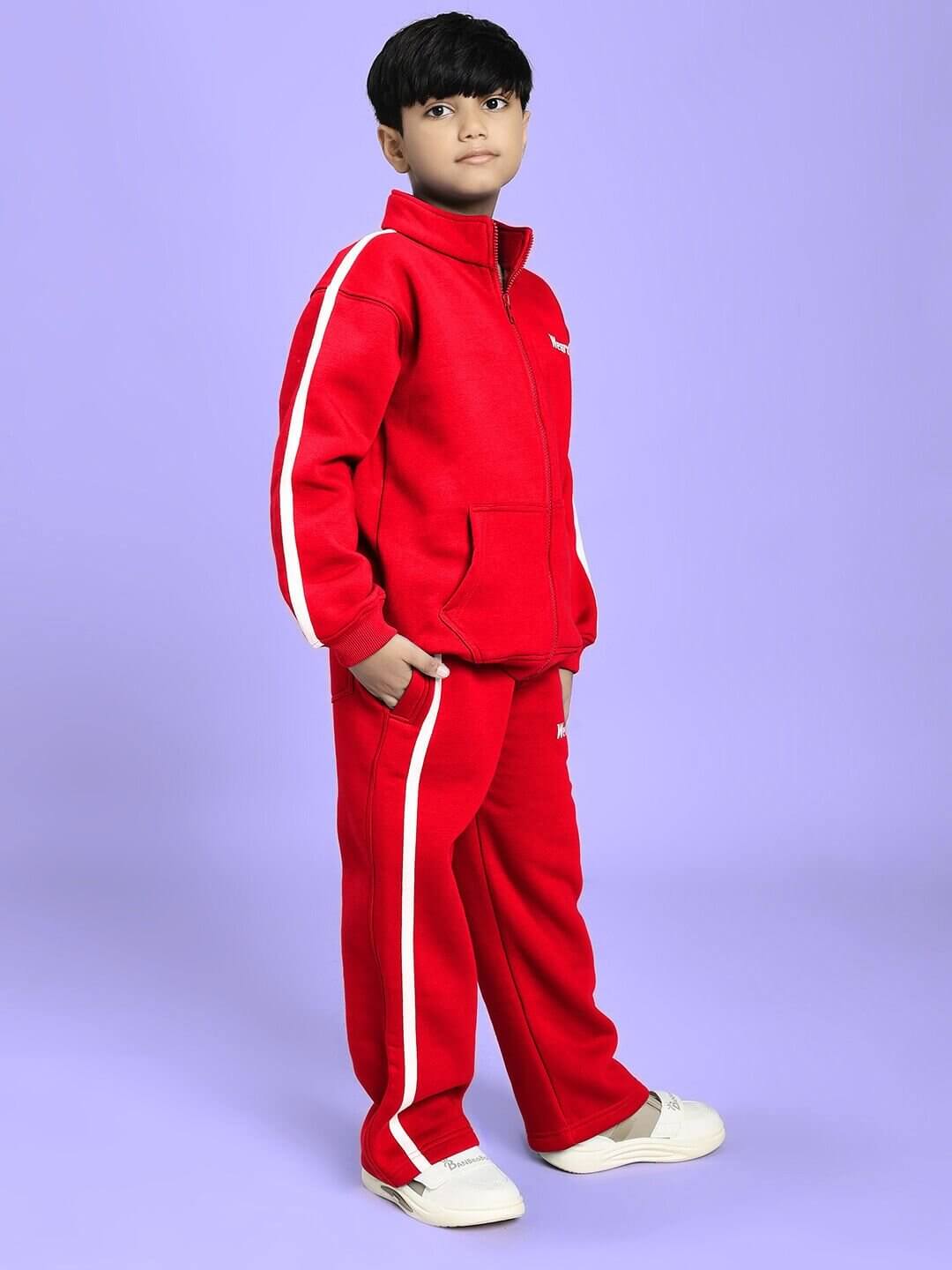 Child wearing RAPID STRIDE FLEECE CO-ORD FOR BOYS AND GIRLS RED, featuring a stylish red jacket and joggers, set against a purple background.