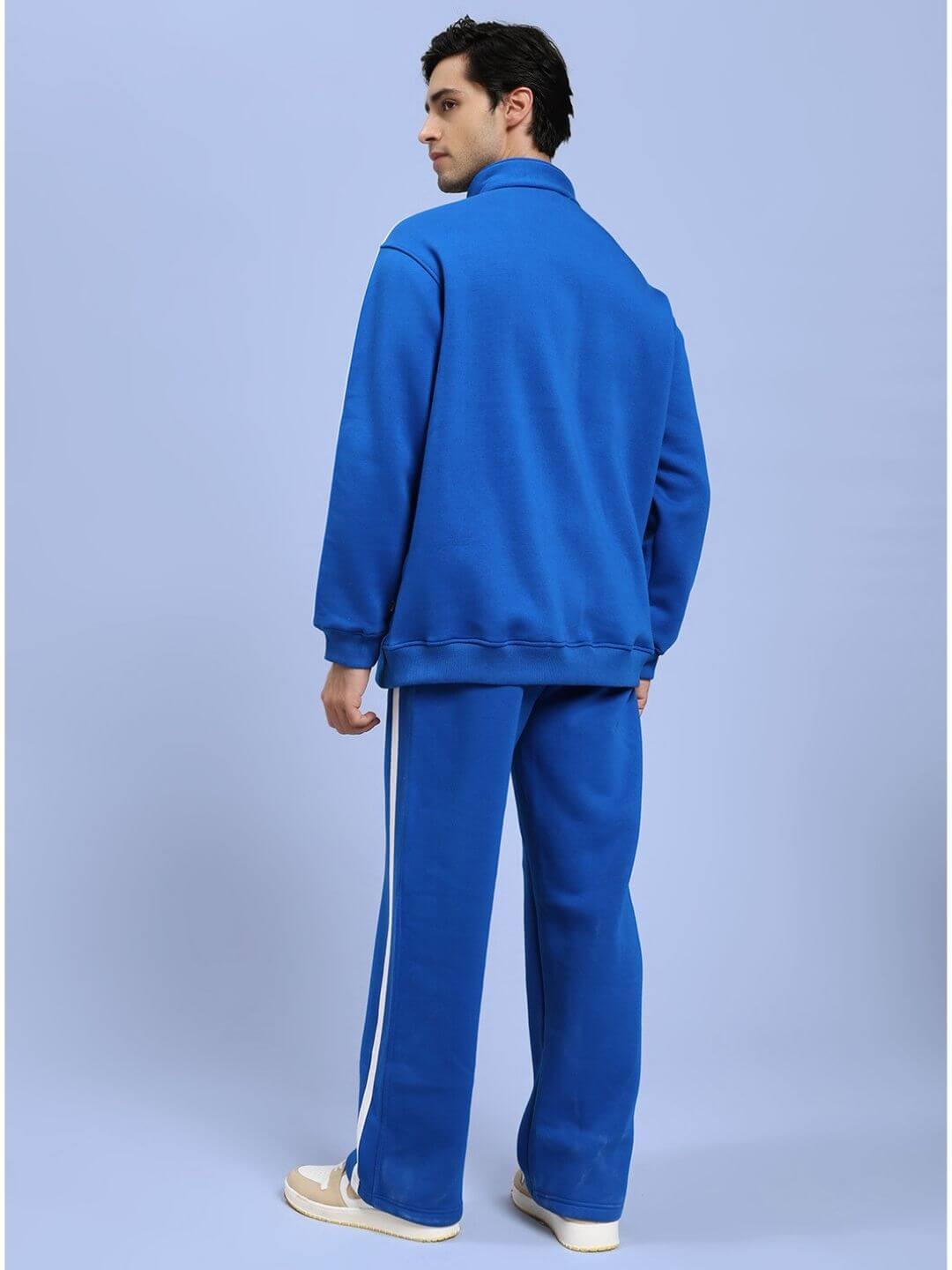 Back view of model wearing RAPID STRIDE ROYAL BLUE COTTON FLEECE CO-ORD SET showing stylish and comfortable design for active wear.
