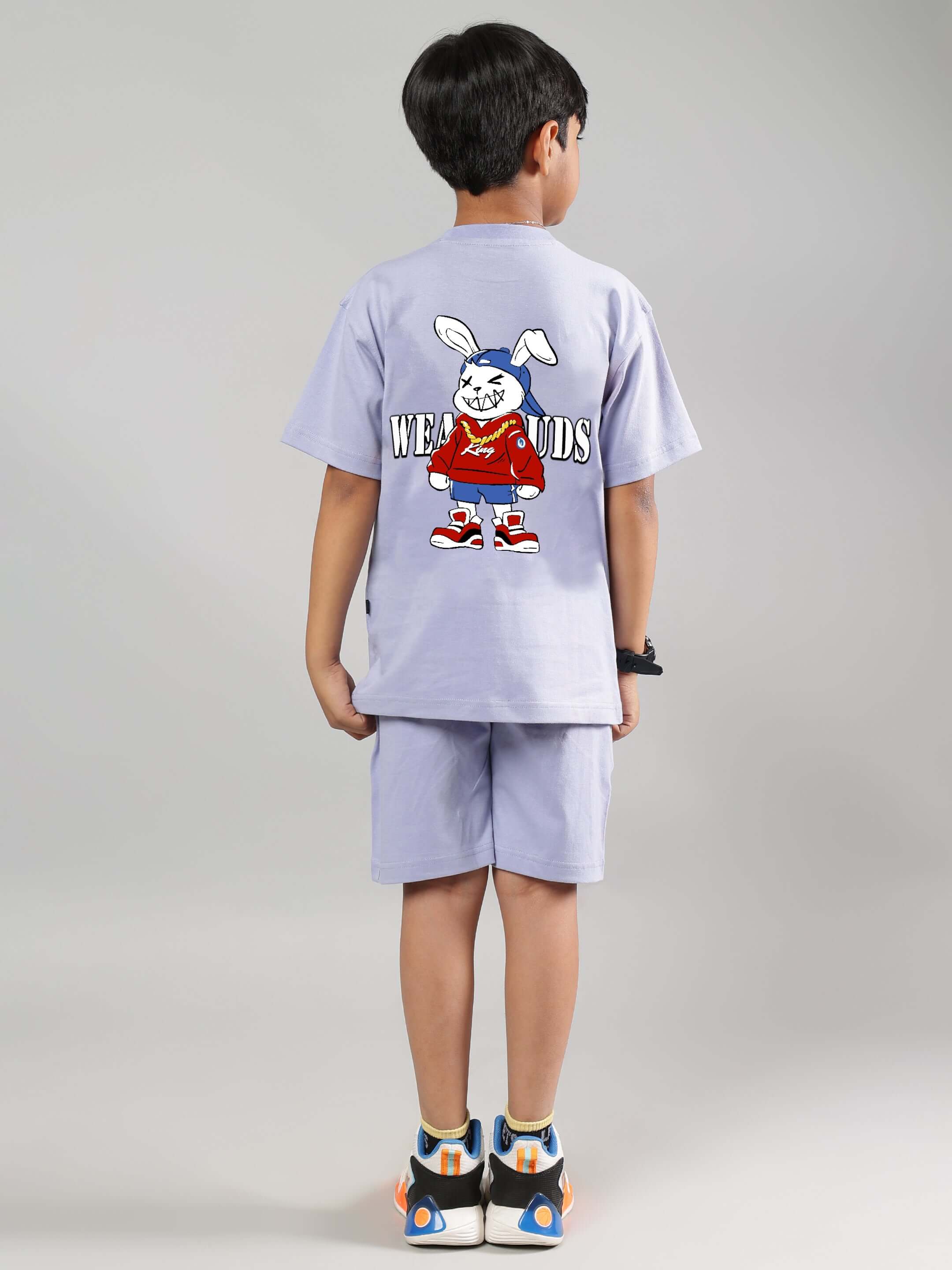 Child wearing lilac Rapper Bunny co-ord set with cartoon design, suitable for boys and girls, made by DUDS. Custom fit available.