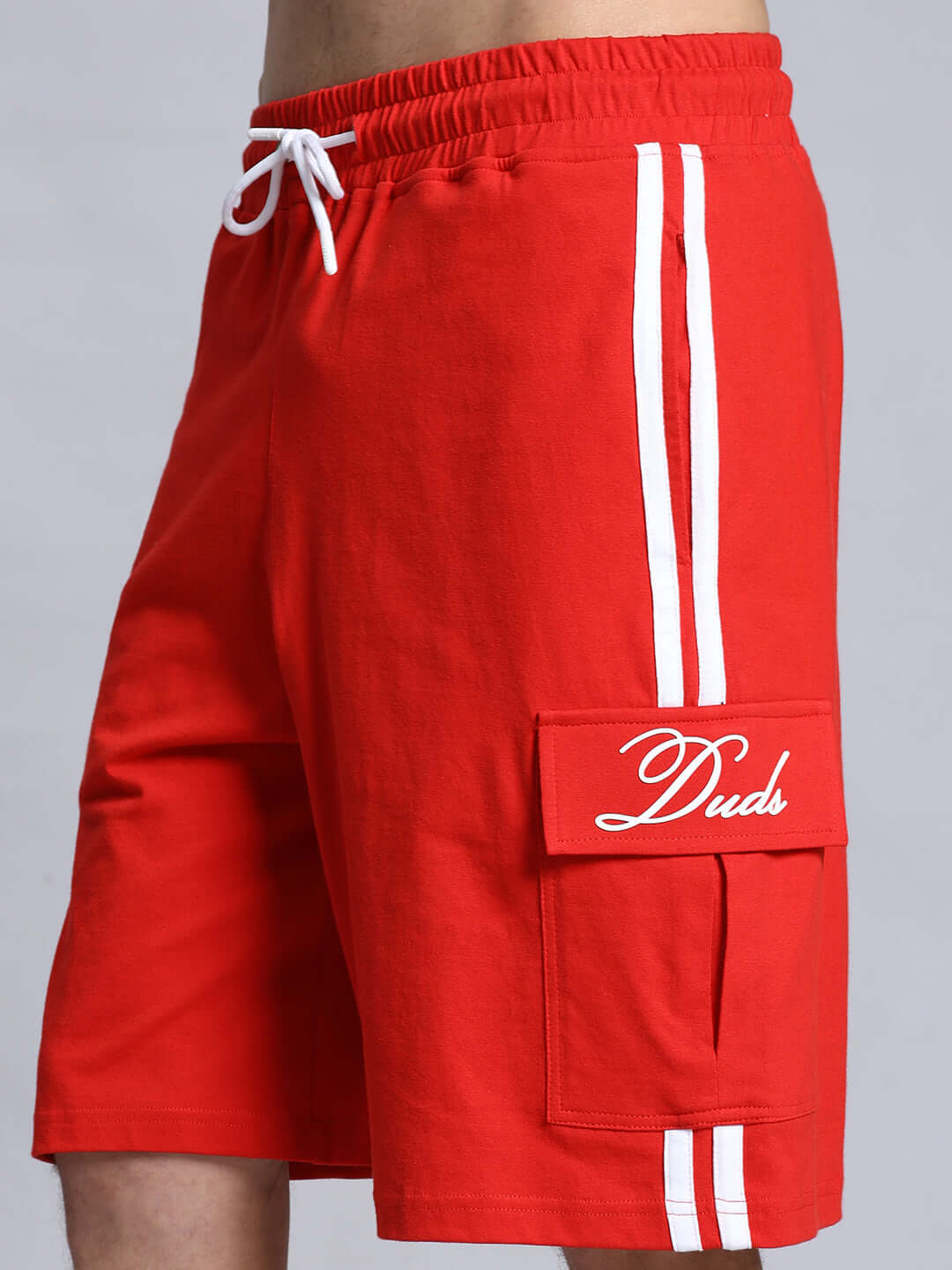Red summer co-ord set shorts made of premium cotton French terry lycra, featuring white stripes and pocket detailing.