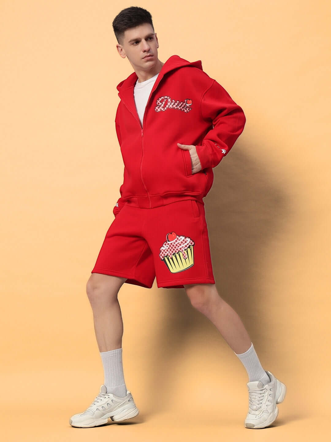 Model wearing CUPCAKE COTTON FLEECE CO-ORD RED, featuring a stylish red hoodie and shorts set, ideal for cozy yet chic streetwear looks.