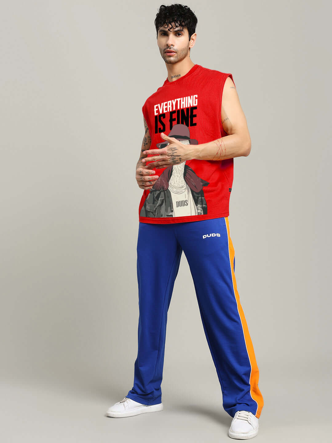 Man wearing EVERYTHING FINE GYM T-SHIRT RED, styled for workout fashion with breathable fabric, bold text print in red color.