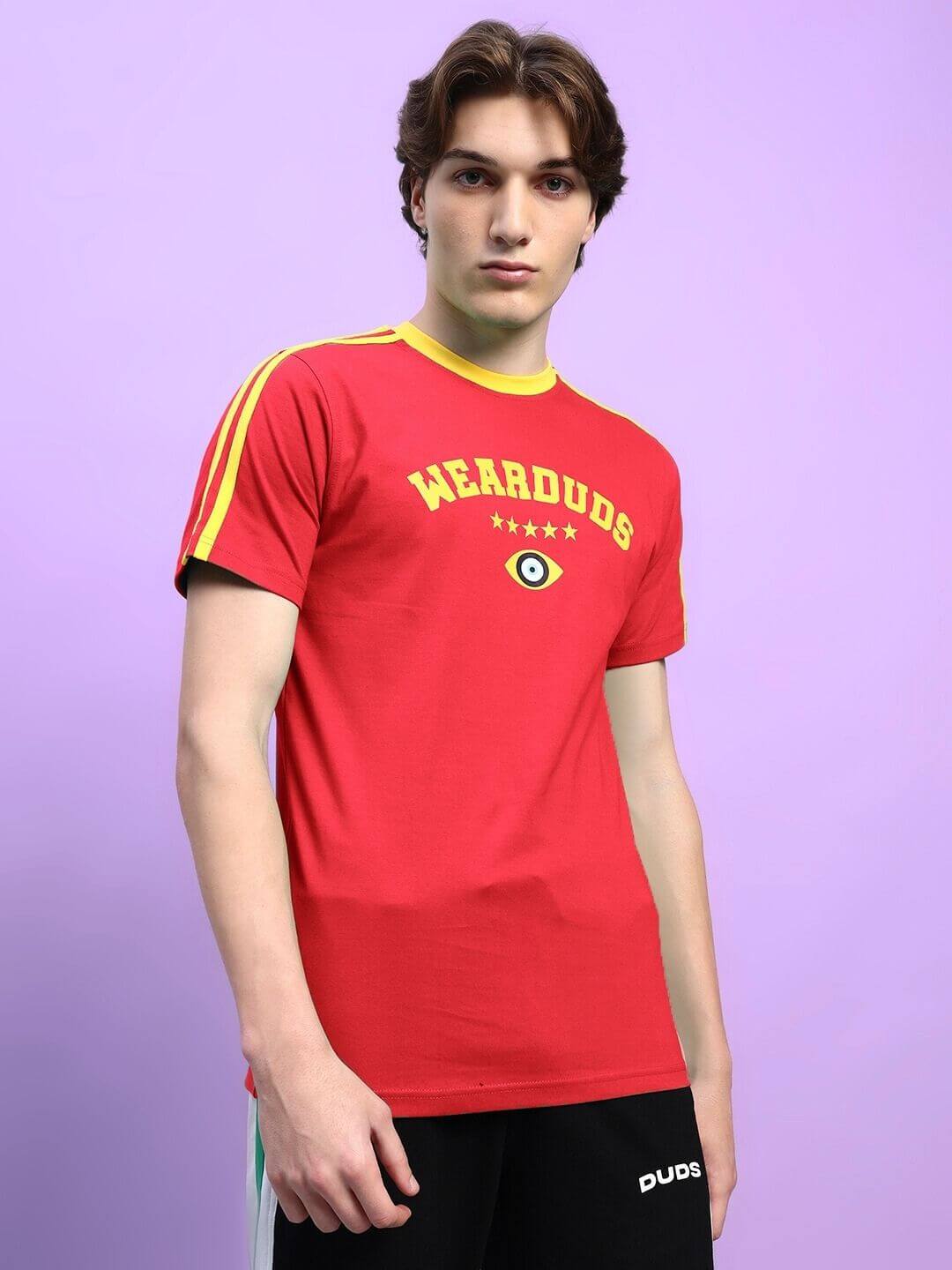 Model wearing the Irish Regular Fit T-Shirt in red with bold lettering and stripe accents; premium cotton blend fabric, crew neck design.