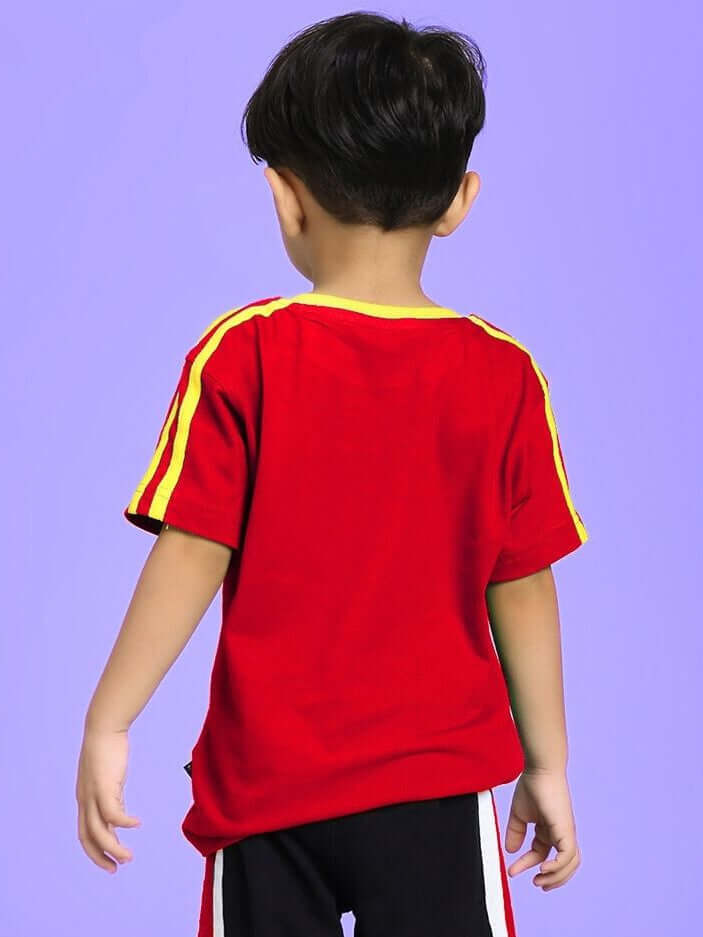 Child wearing IRISH T-SHIRT FOR BOYS AND GIRLS RED, showing bold red color and striped design, suitable for casual and festive occasions.