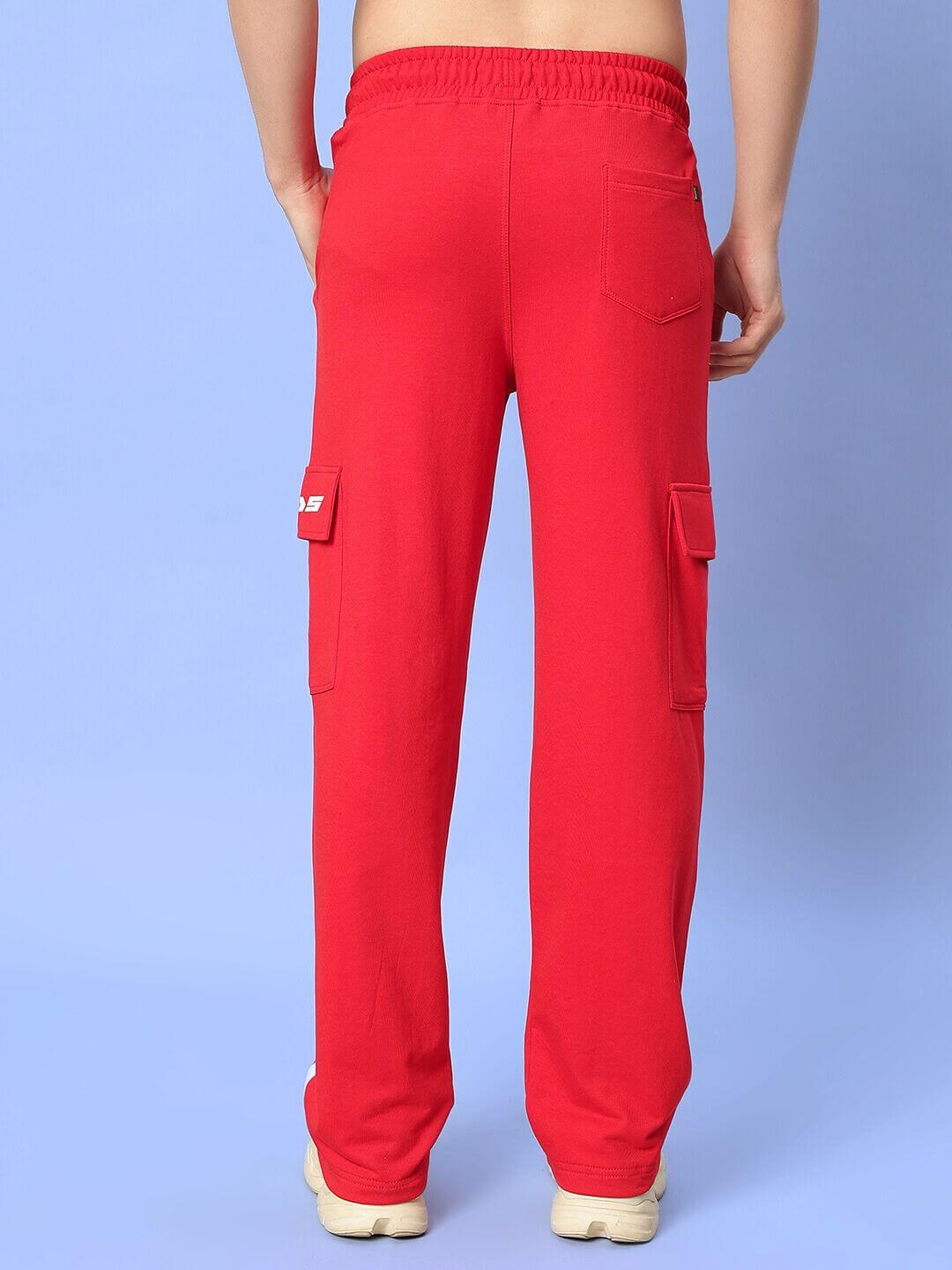 Back view of red relaxed fit joggers with elastic waistband from Ricky Co-Ord Set showing pocket details on a light blue background.
