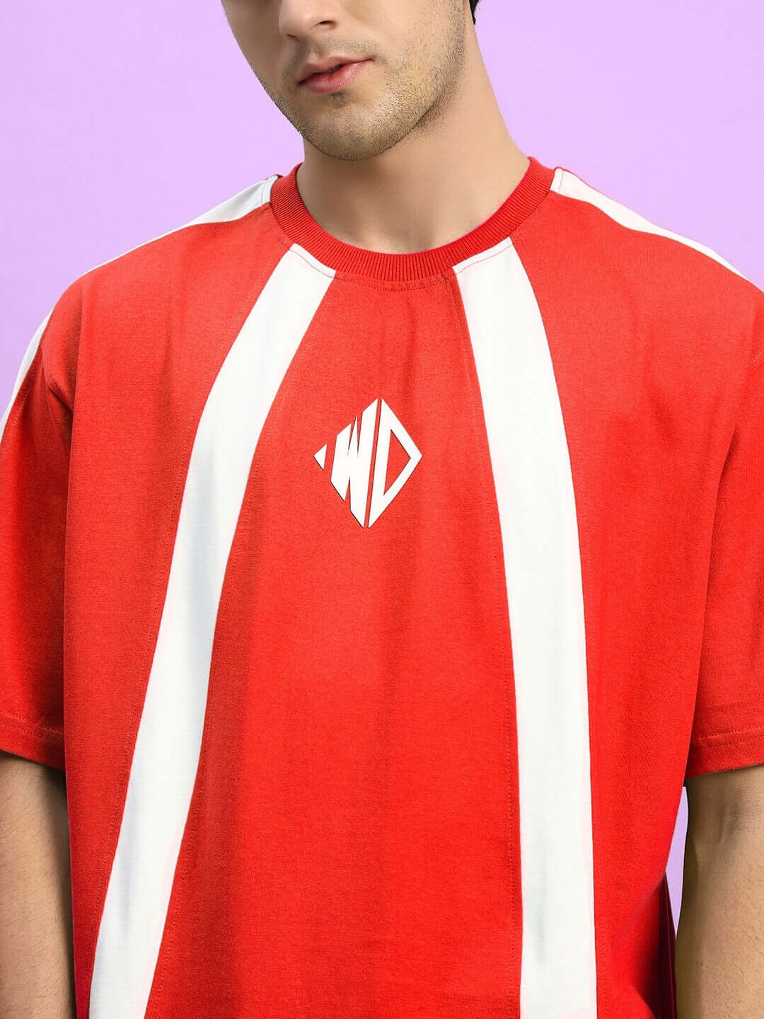 Model wearing the WIDELINE SUMMER CO-ORD SET RED t-shirt showcasing bold design and comfort.