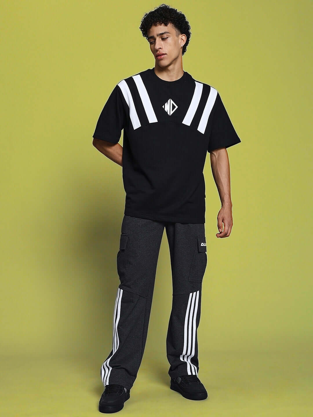Model wearing REDROIT dark grey relaxed fit joggers, showcasing the stylish 5-pocket design and urban casual look.