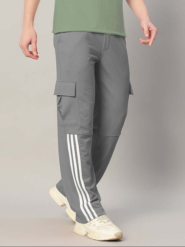 Grey REDROIT relaxed fit joggers with side pockets and stripes, perfect for customized fit. Comfortable and stylish activewear by DUDS.