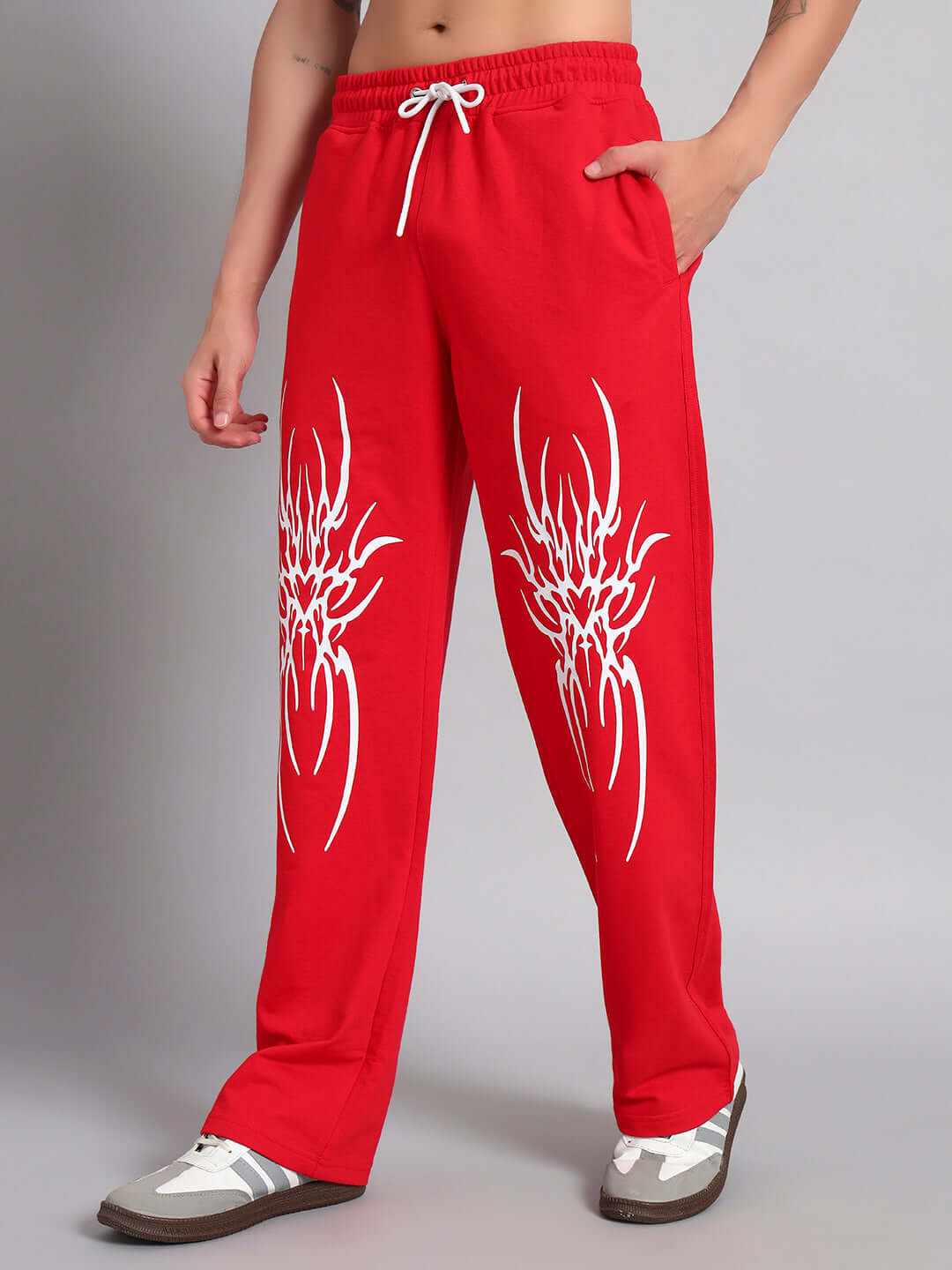 Person wearing REDX BRANCHING COTTON JOGGER RED MEN, featuring white designs, customizable fit available, made by experienced tailors.