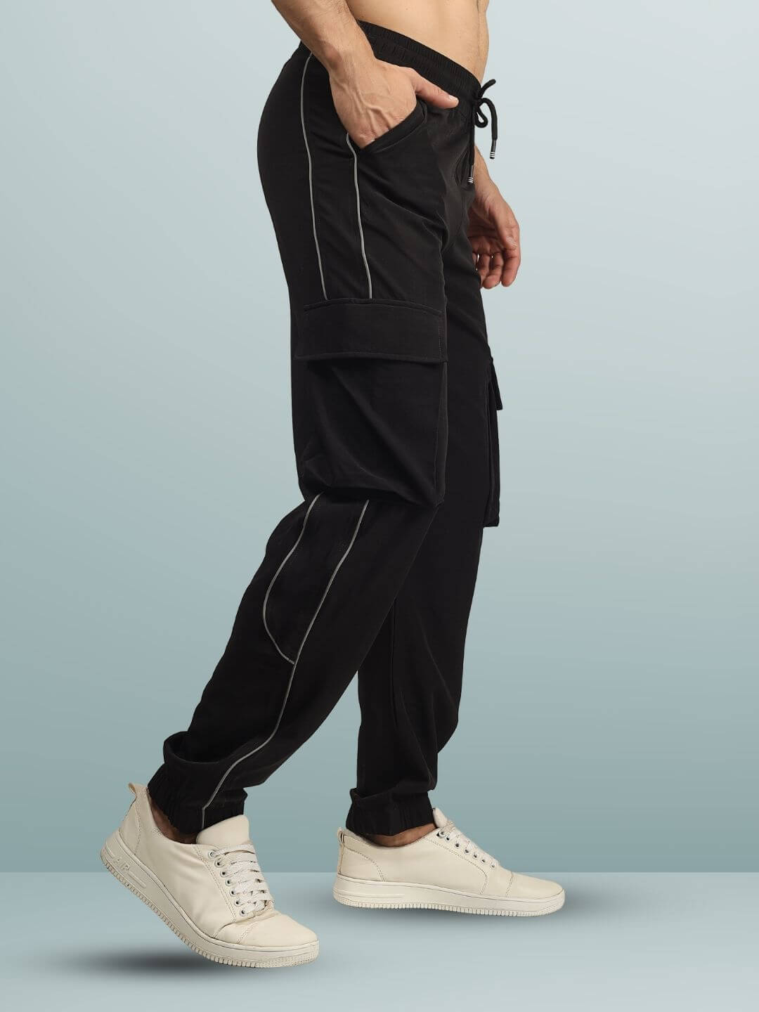 REFLECTOR CARGO PANTS 2.0 in black with customizable fit feature, side view showing design details and comfort fit.