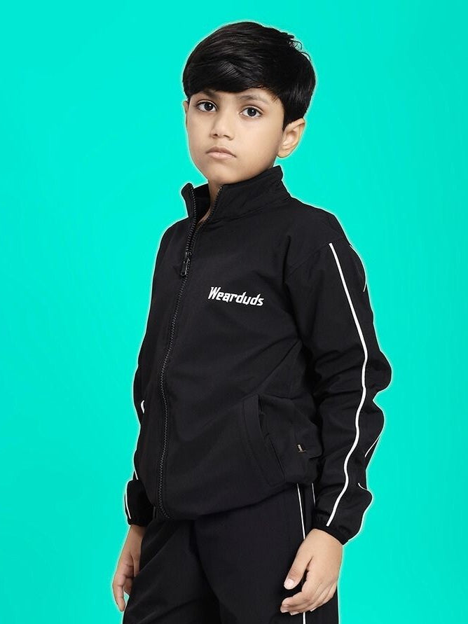 RELIGHT RELAXED FIT JACKET FOR BOYS AND GIRLS BLACK worn by child on turquoise background