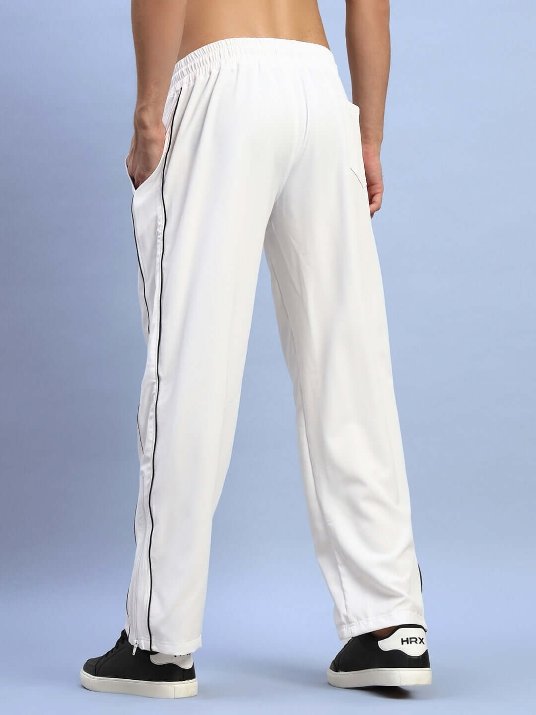 Back view of white RELIGHT RELAXED-FIT JOGGERS with black stripe, showcasing comfortable fit and style, perfect for casual wear.