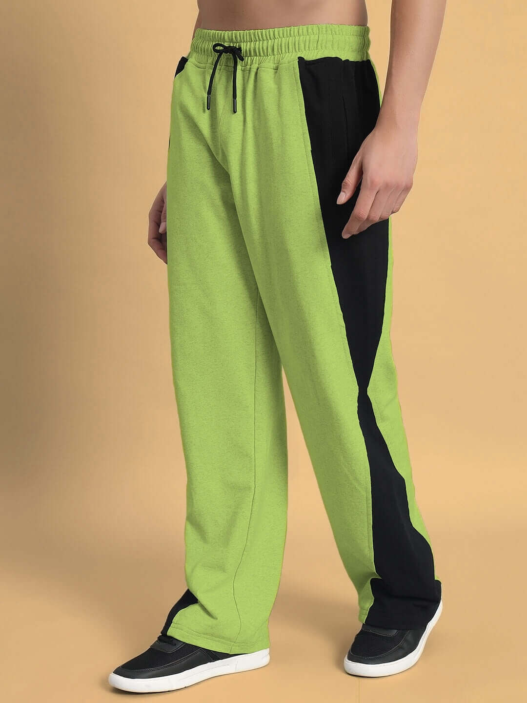 Neon green joggers with side contrast design, custom fit option, made by DUDS expert tailors, shown on model for premium look.