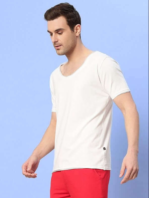 Man wearing Ricky Regular Fit T-Shirt in white, crafted from 100% cotton, showcasing a comfortable and casual style.