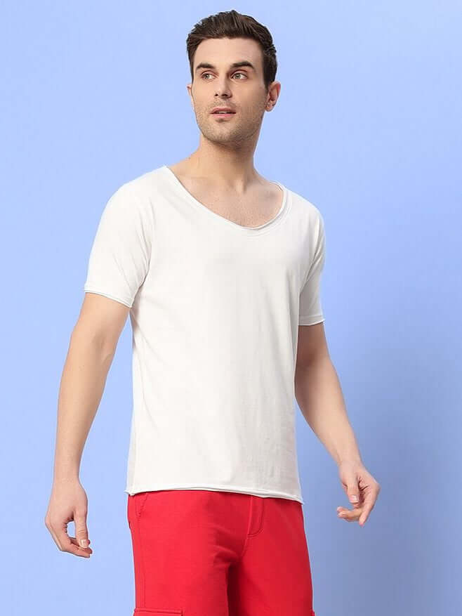 Man wearing Ricky Regular Fit White T-Shirt with red shorts, made of 100% cotton, ideal for casual wear.