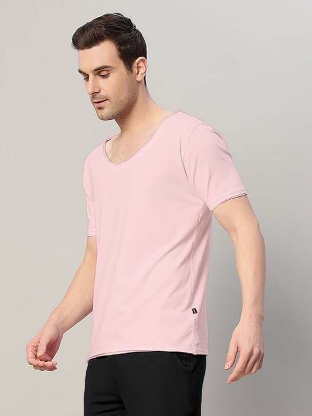 Model wearing Ricky Regular Fit T-Shirt in baby pink, made of premium 100% cotton, 190 GSM fabric, showcasing style and comfort.