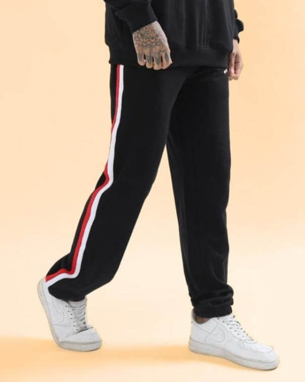 RIGHTMAN Jogger in black with red and white side stripe, made to order by DUDS, customizable fit options available, shown with white sneakers.