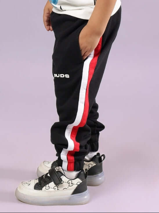 RIGHTMAN JOGGER FOR BOYS & GIRLS BLACK - stylish and comfortable joggers for active kids, featuring red and white side stripes.