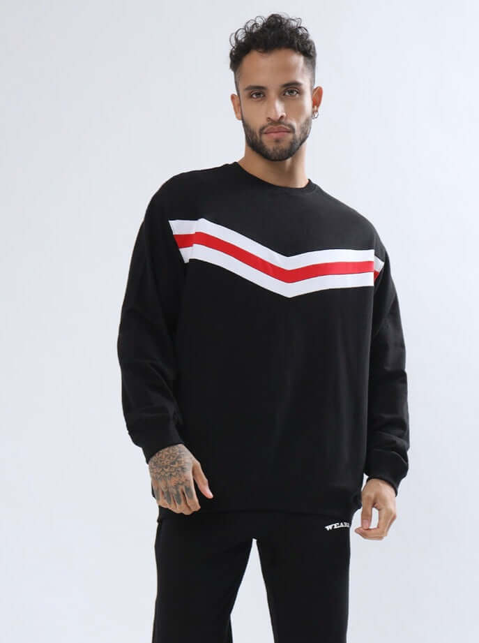 RIGHTMAN Oversized Sweatshirt made of premium cotton French terry, featuring red and white stripes, worn by a model. Cold machine wash.
