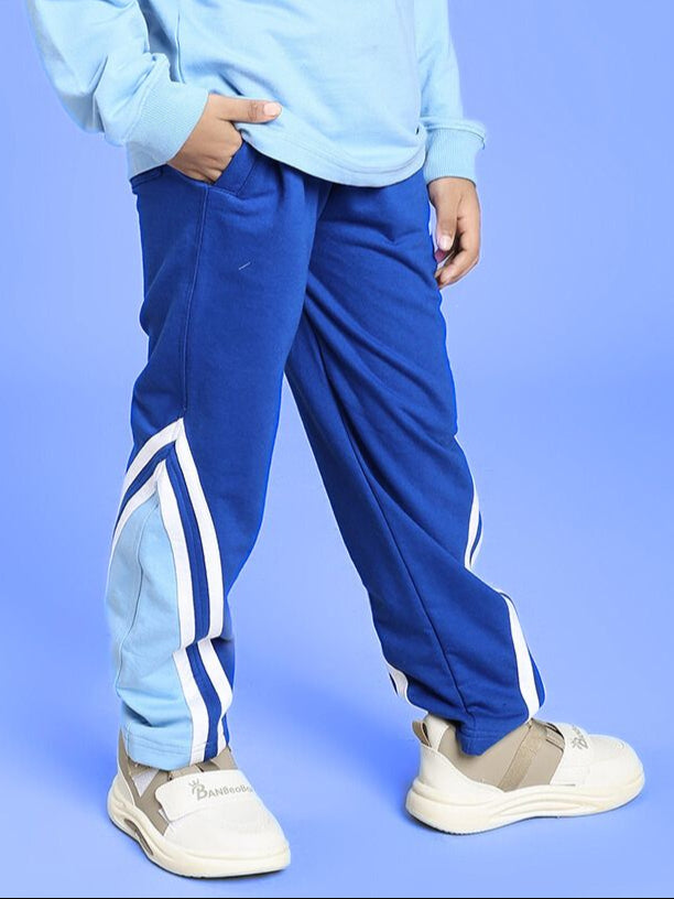 Child wearing RIO ONE RELAXED FIT JOGGER FOR BOYS AND GIRLS BLUE with a casual style and comfortable fit, perfect for kids' everyday wear.