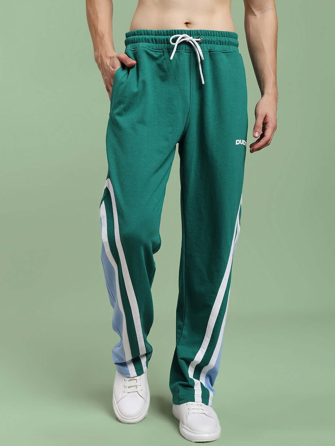 RIO ONE relaxed fit joggers in teal green with white stripes, worn by model. Custom fit option available, tailored by DUDS.