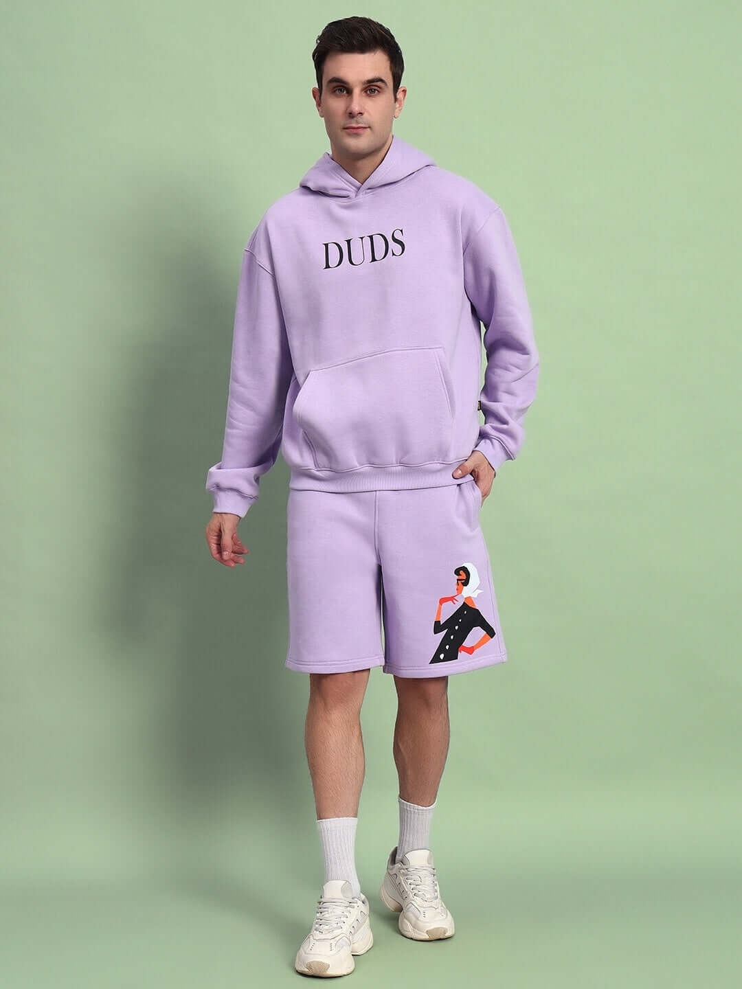 Model wearing WEARDUDS RITZY FLEECE CO-ORD LILAC hoodie and shorts set.
