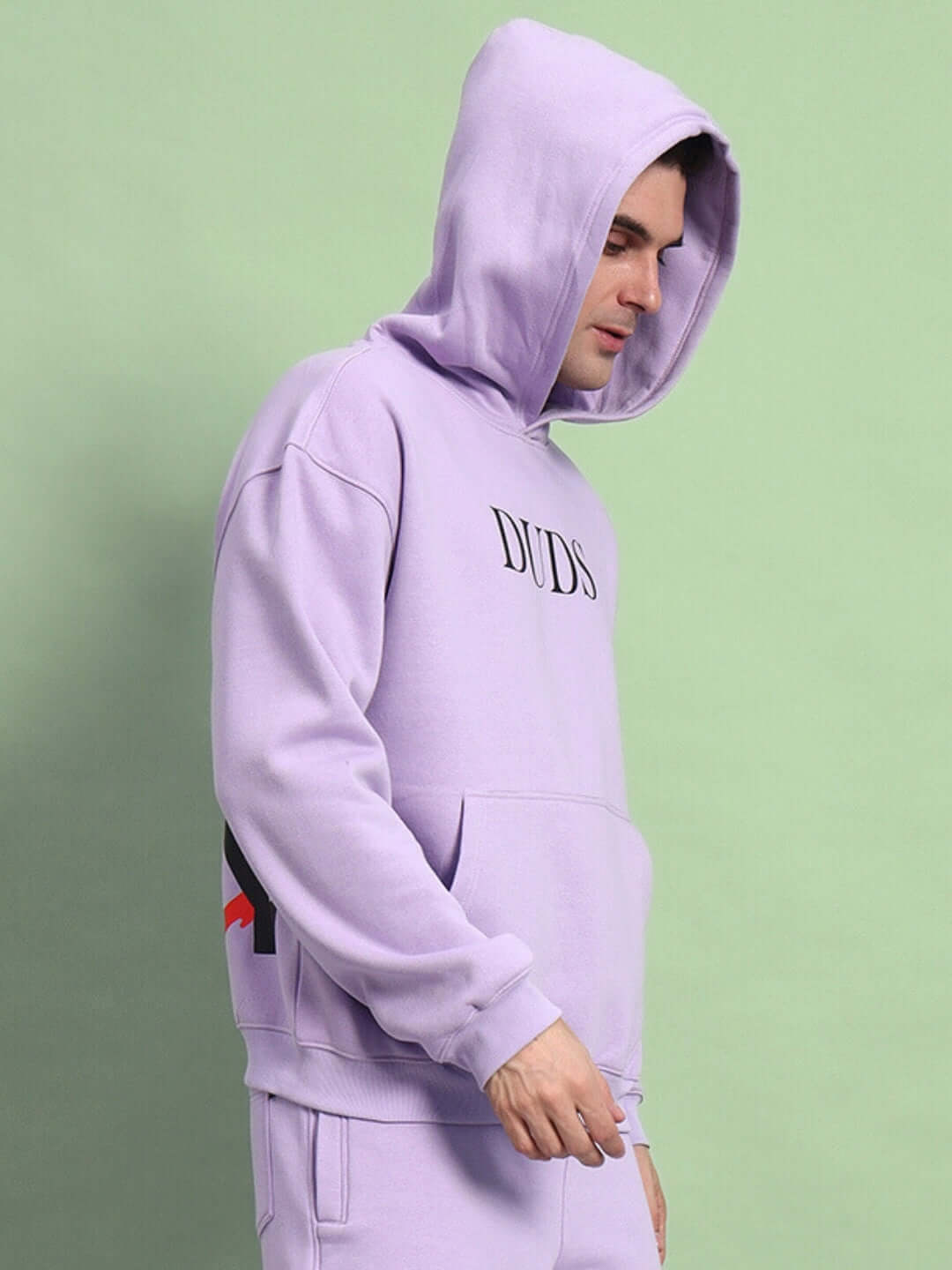 Person wearing WEARDUDS RITZY FLEECE HOODIE LILAC with hood up, featuring comfortable fit and stylish design.