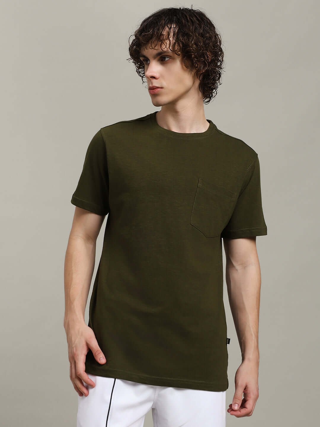 Olive regular fit t-shirt in premium heavy cotton slub fabric, modeled on a person. The t-shirt features a simple, stylish design.