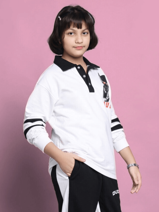Child wearing white oversized Robin sweatshirt, featuring premium cotton fabric, against a pink background.