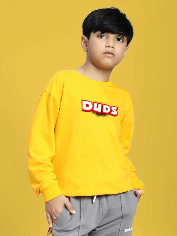 Kid wearing a ROBLOX SWEATSHIRT FOR BOYS AND GIRLS YELLOW showcasing a vibrant gaming-inspired design.