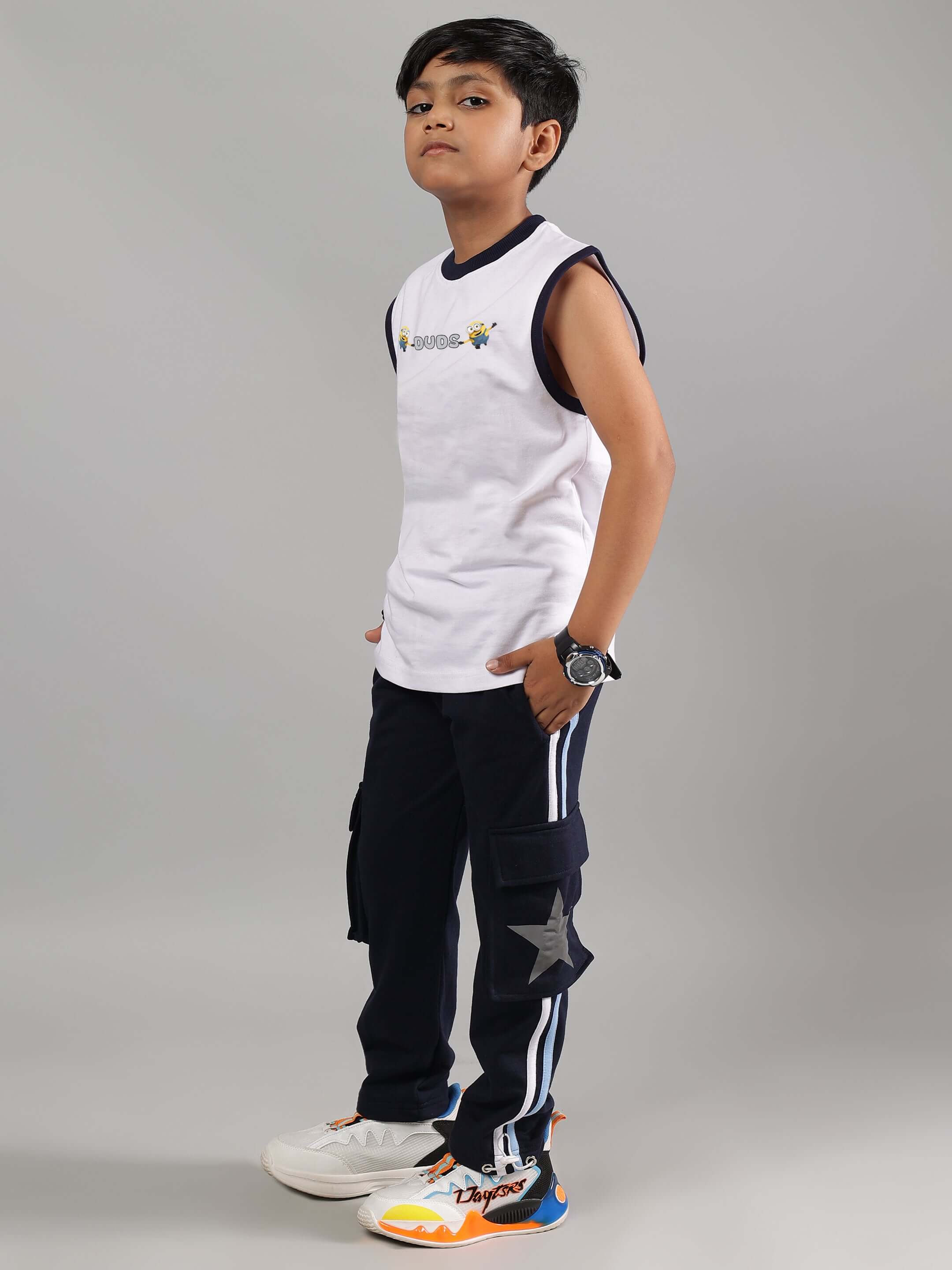 Child wearing ROBO MINIONS CO-ORD FOR BOYS GIRLS WHITE NAVY, featuring futuristic white top and navy pants, perfect for playful style.