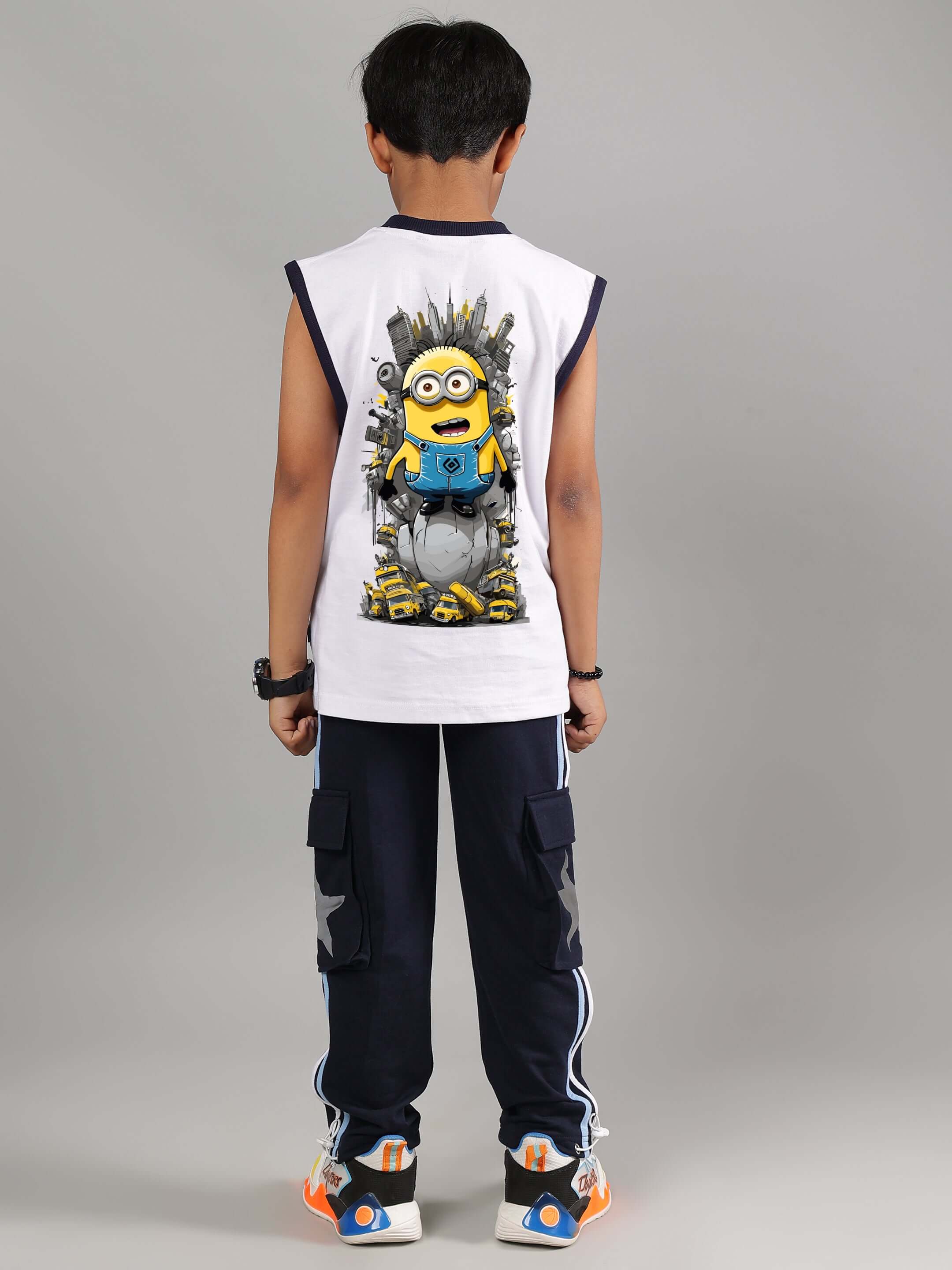 Boy wearing white and navy ROBO MINIONS co-ord set, featuring graphic minion design on back. Perfect for boys and girls. Customizable size available.