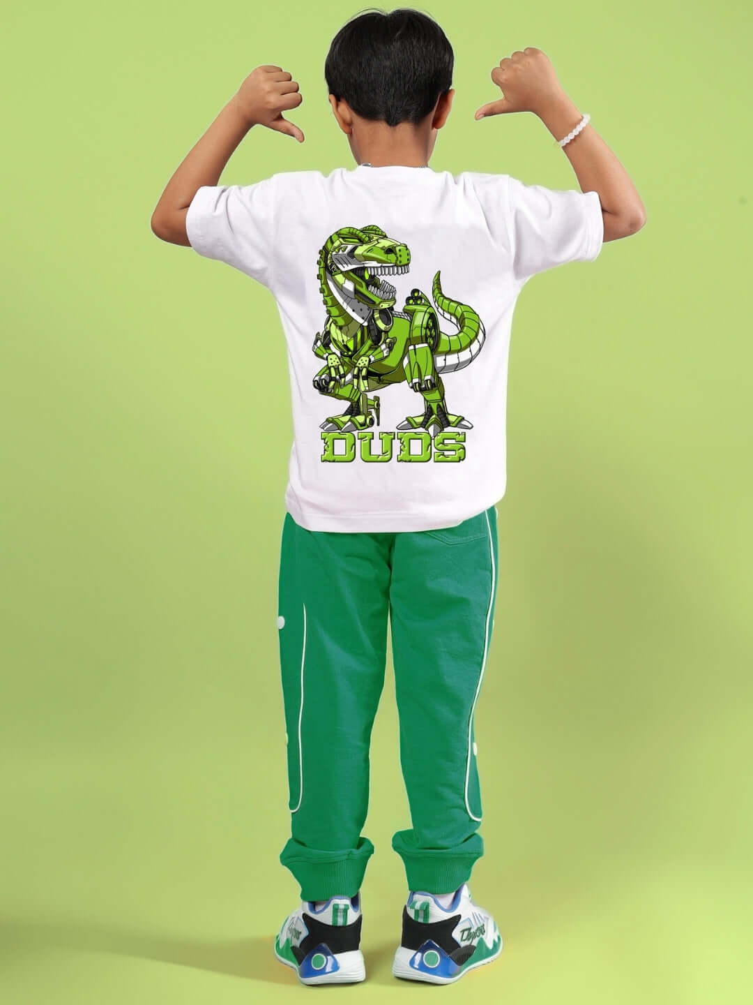 Child wearing white-green ROBO REX co-ord featuring a dinosaur and robot print, outfit by DUDS. Suitable for boys and girls.