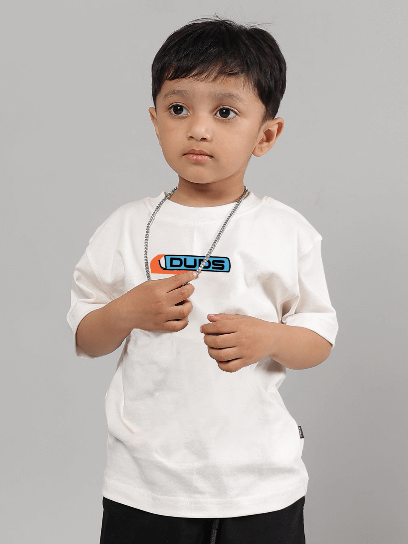 Boy wearing white Robo Shark T-shirt by DUDS for boys and girls, made by experienced tailors, customizable size option available.