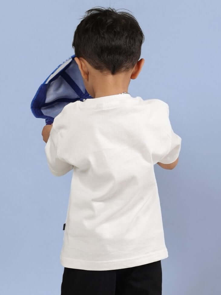 Child wearing an off-white Robo Super T-Shirt, showcasing back and sleeve fit, with vibrant graphic print not visible, against a blue background, ROBO SUPER T-SHIRT FOR BOYS AND GIRLS OFF WHITE