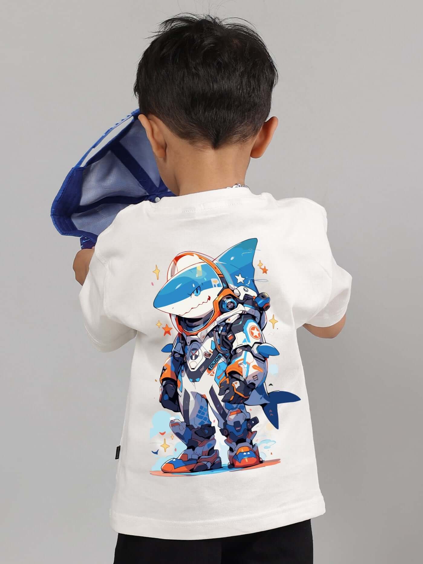 Child wearing white Robo Shark t-shirt, colorful robot shark design on back, boys and girls clothing