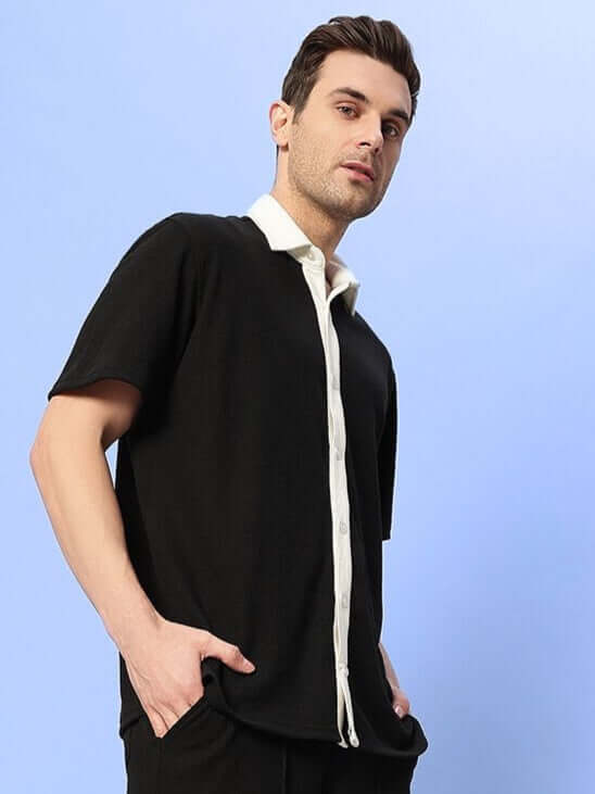 Robson regular fit black shirt in waffle fabric, modeled by a 6-foot tall man wearing size large. Half sleeves ideal for all-day comfort.