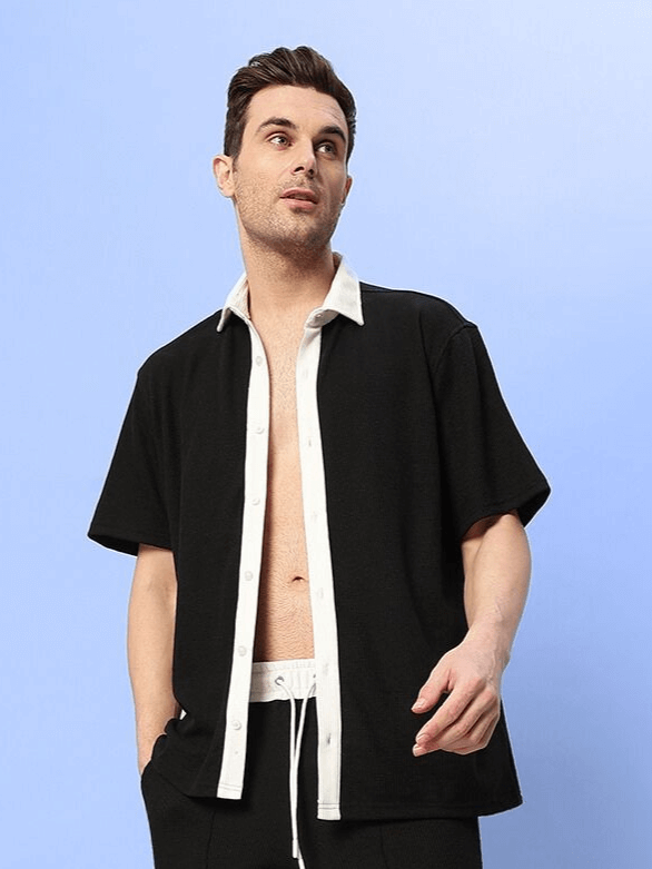 Model wearing Robson Regular Fit Black Shirt in waffle fabric, white trim, half sleeves, suitable for day wear, 100% cotton, 240 GSM.