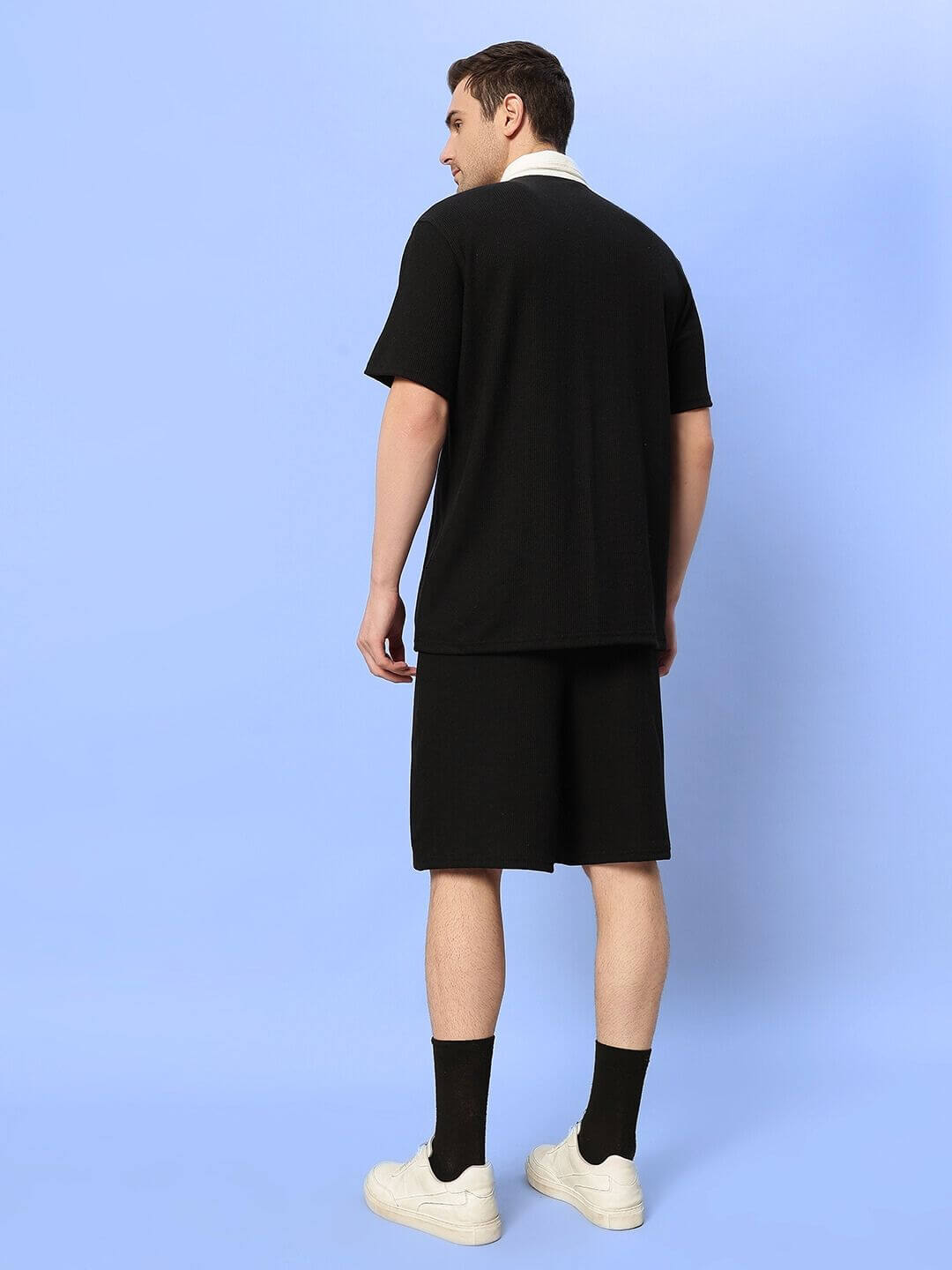 Model wearing ROBSON Co-Ord Set in black waffle fabric, rear view, showcasing relaxed fit and short sleeves. Perfect for casual wear.