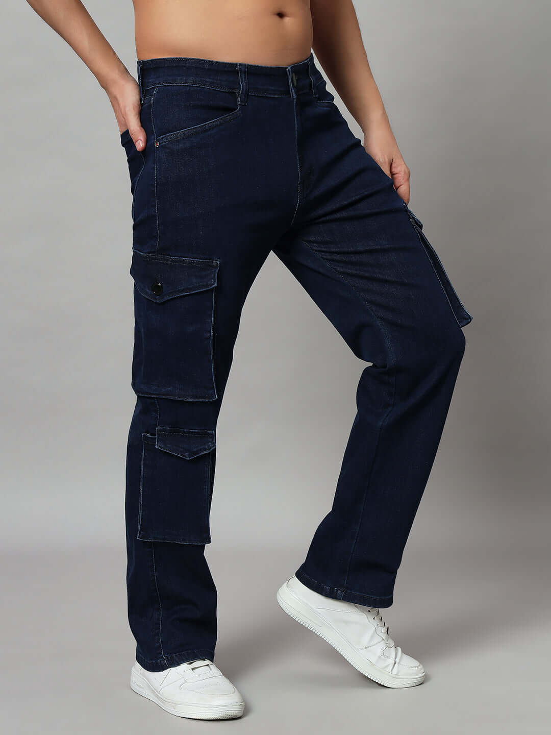 Man wearing navy relaxed denim cargo jeans with side pockets, showcasing modern casual style
