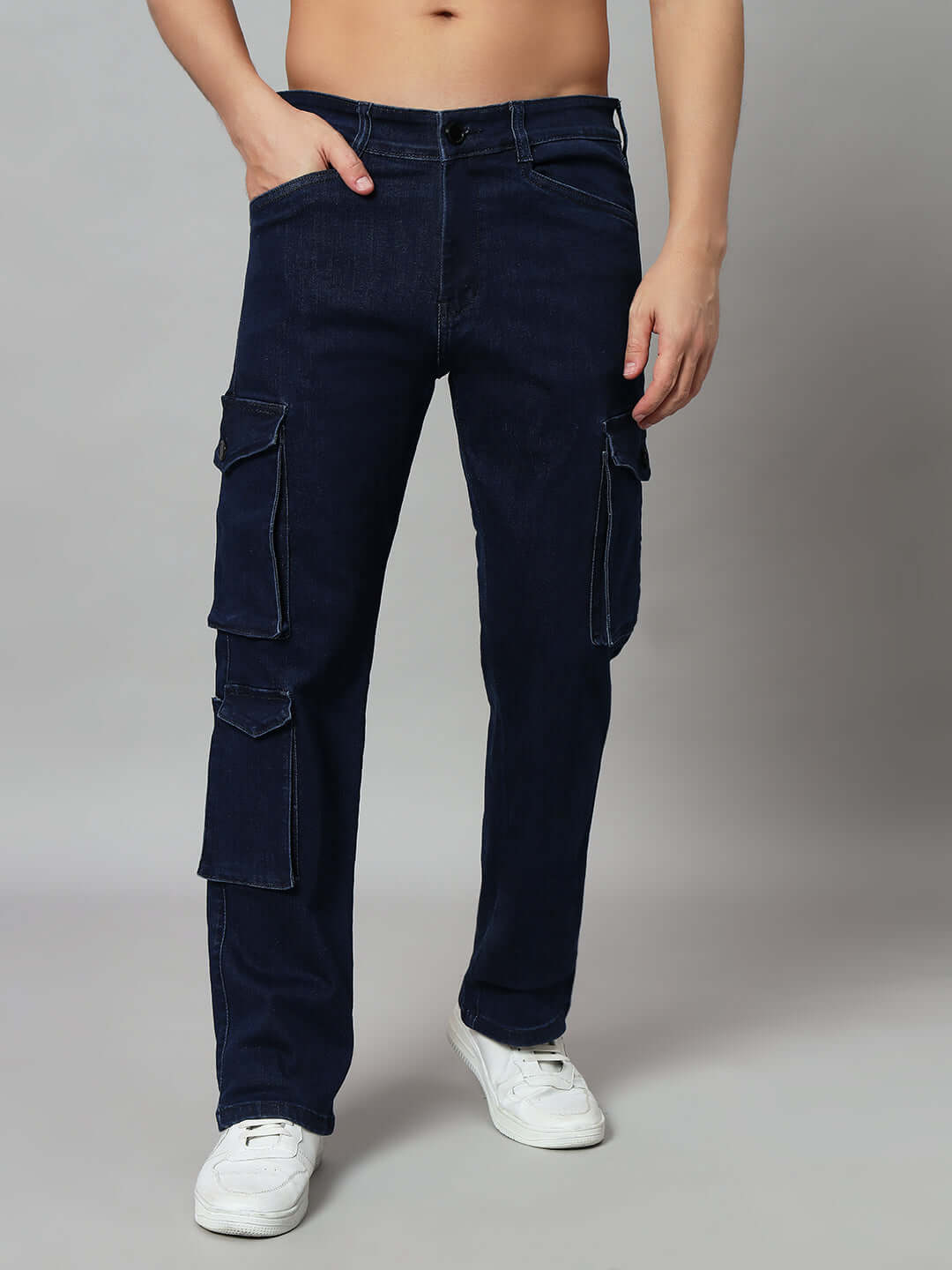 Alt Tag: Navy relaxed fit denim cargo jeans with multiple pockets worn with white sneakers, tailored by DUDS.