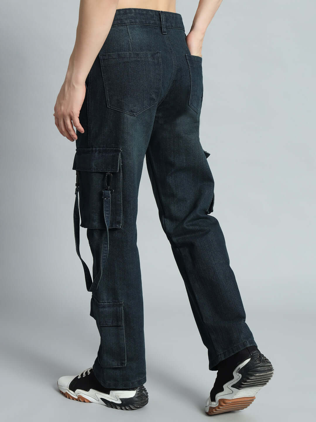 Model wearing Rockie Relaxed Denim Cargo in blue, showcasing custom fit option by DUDS. Made to order, shipping in 7-10 days.