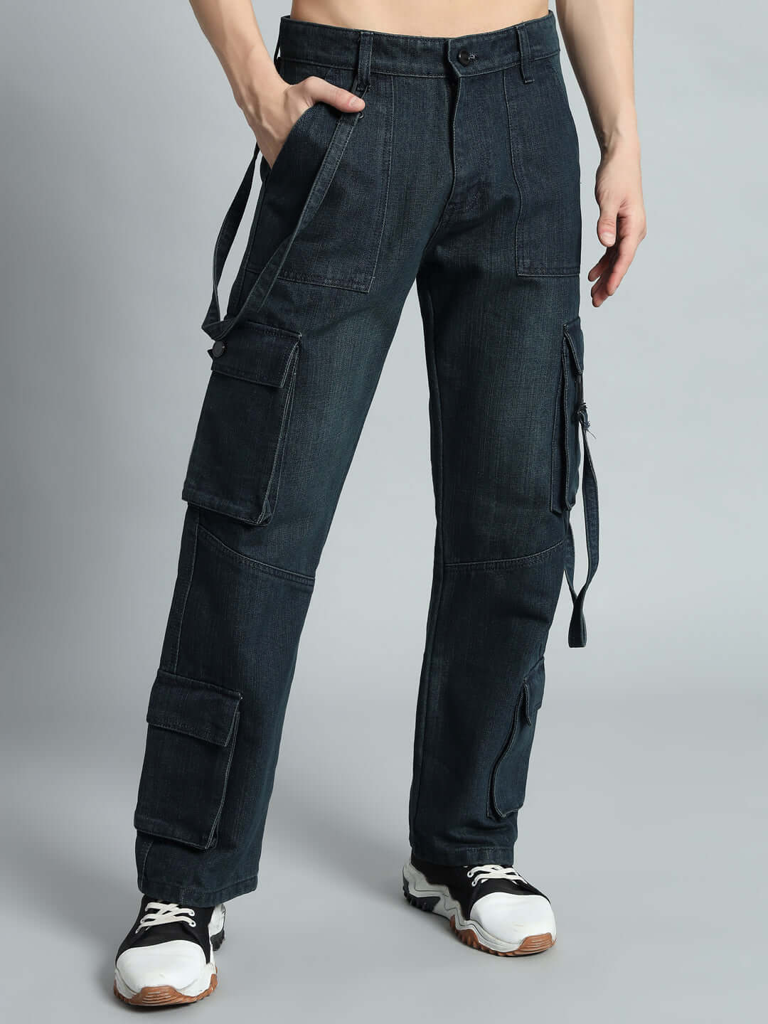 Model wearing Rockie Relaxed Denim Cargo pants in blue, featuring multiple pockets, ideal for modern casual style.