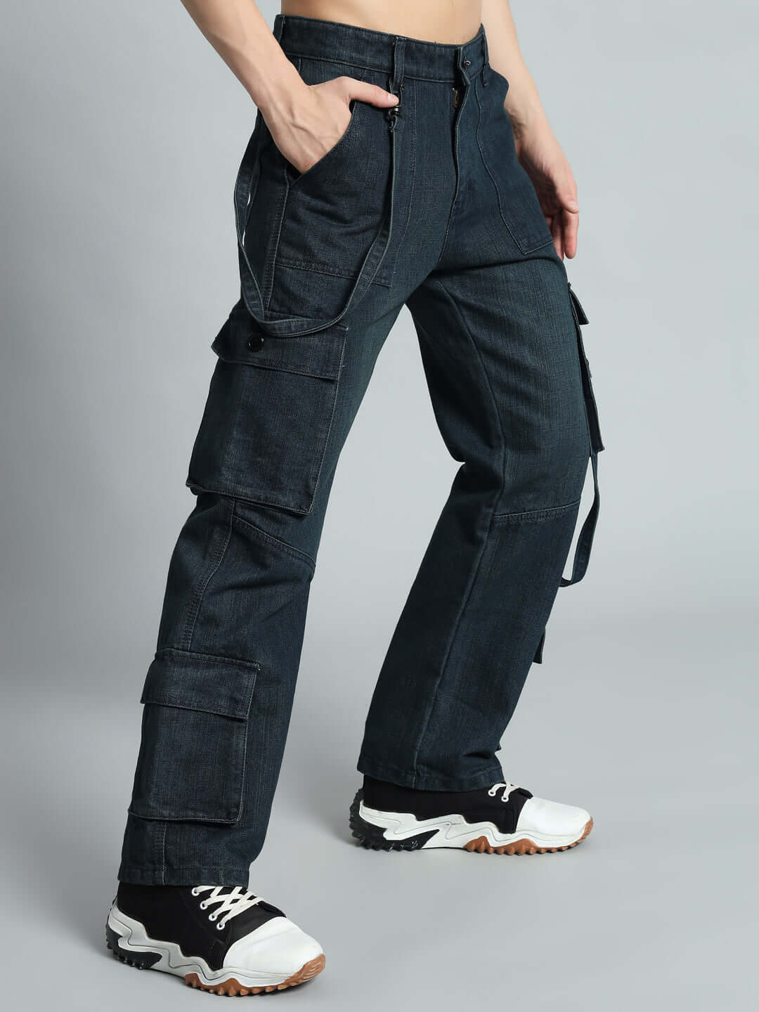 Model wearing Rockie Relaxed Denim Cargo Pants in blue, showcasing front pockets and relaxed fit style.